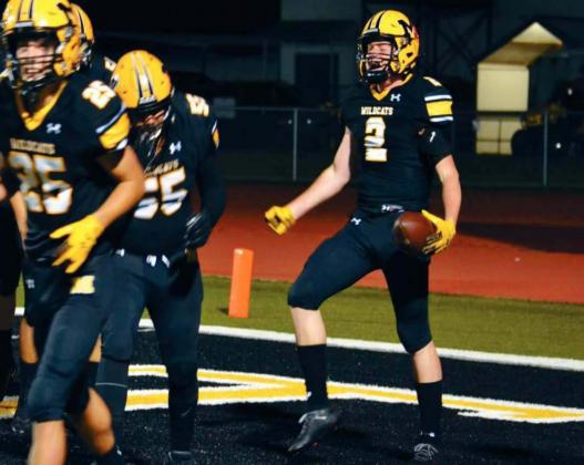 Madill Sophomore Stephen Sisco, #2, celebrates scoring the first touchdown of the night for the Wildcats along with sophomore Josh Burt, #25 and junior Jorge Martinez, #55. Unfortunately, the celebration was short lived. The Redskins beat the Wildcats 49-14. Summer Bryant • The Madill Record