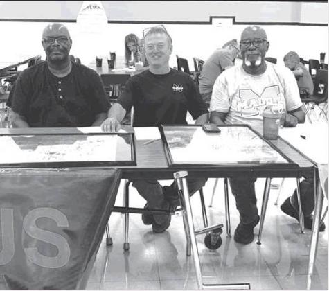 Courtesy Photo Tim Davis, Kevin Peoples, and Frank Davis sit poised and ready to assist during the enrollment event at Madill schools.
