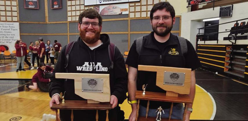 Austin Pettigrew (right) coaches Madill wrestling and his brother, Blake (left), coaches for Ada. Austin's boys team took 2nd and his girls team took 3rd in the Ada tournament. Blake's team took 1st in the tournament. Courtesy photo