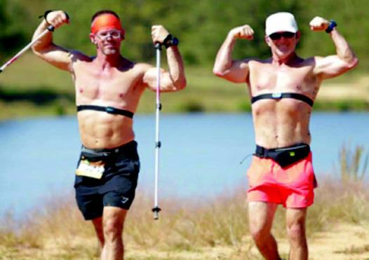 Mark Meeks and Chad Gambel flex during the race. Courtesy photo