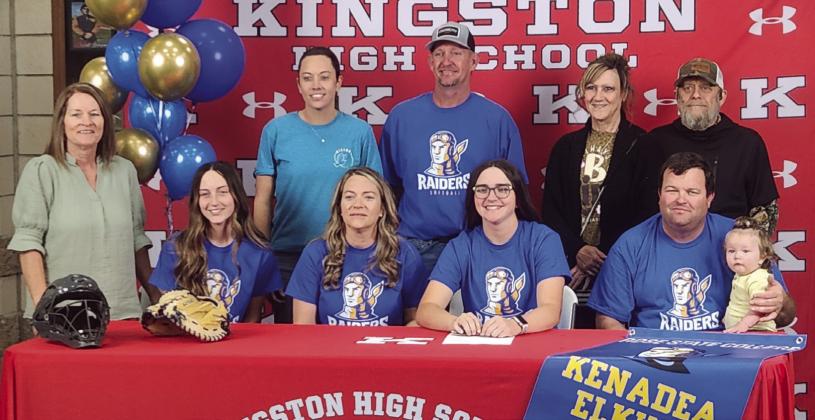 Keneda Elkins, pictured with her family and coaches, signed to play softball for Rose State College. Andrea Dunlap • The Madill Record