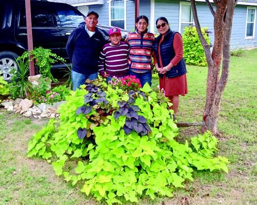 Courtesy photo Andres and Maribel Guevara, pictured with their children, Tobith and Camila, were awarded the Madill Rose Garden Club's October Yard of the Month.