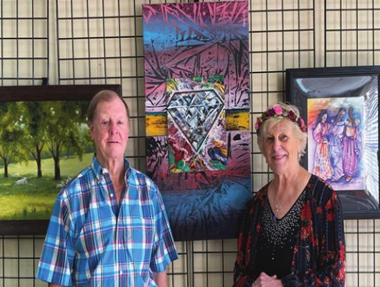 Herschel Beard and Nancy Murphy Griffth, President of the Art Club in Madill, getting everything ready for the art show at the Expo Center’s 60th Anniversary. Summer Bryant • The Madill Record