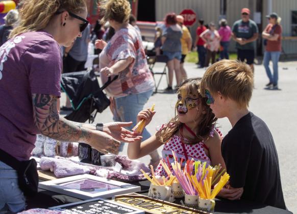 Salem Hudson and River Willis visit a vendor at Spring Fest. Photo by Matt Swearengin