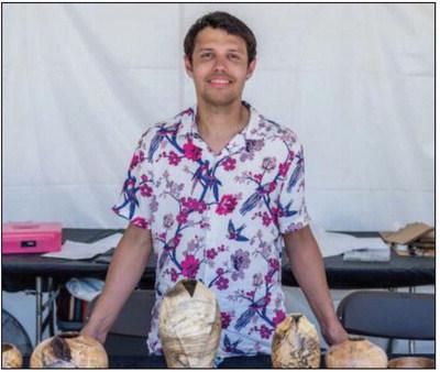 Micah Hart is shown with artwork, alongside “Dancer,” a hackberry and crushed blue stone creation that won Best of 3-D at the 2025ArtesianArts Festival June 7 in Sulphur, Oklahoma. Courtesy photo