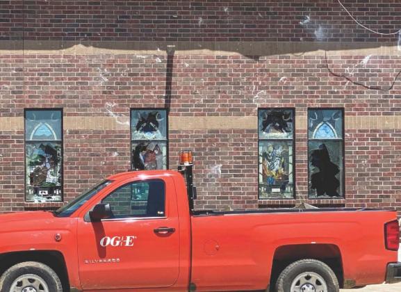 An OG&amp;amp;amp;E truck is parked in front of the Holy Cross Catholic Church in Madill. The church sustained heavy damage during a tornado on April 22. Charlie Hannema • Office of the Governor