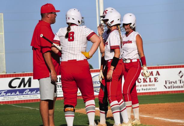 Coach Minor talks to the girls during the game. Rylee Gorlee