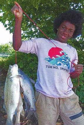 Lavish Wiley, 15, holds a nice mixed stringer he caught while fishing on the Verdigris River on Father’s Day 2020. (Photo courtesy Fred Wiley) Courtesy photo