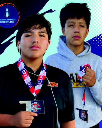 Alexander Sarabia and Brayden Valles hold their medals. They both won medals at the Oklahoma Open at Midwest City High School. Courtesy photo