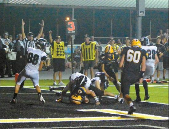 Tony McSwain • The Madill Record MADILL SENIOR FULLBACK John Venable scores a touchdown to make the score 14-13 in favor of the visiting Lone Grove Longhorns. Madill kicker Francisco Perez would tie the game at 14 points apiece on the next play with his extra point kick. The Wildcats went on to the lose 22-20 in overtime. By Matt Caban The Madill Record
