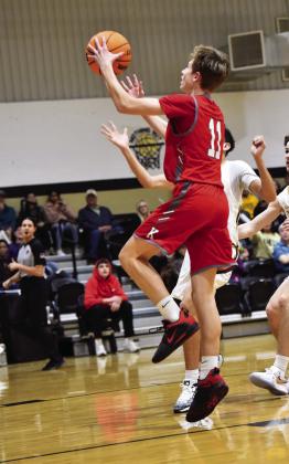 Brock Rumer goes for a layup during the Kingston v Marietta game. Crockett Uber