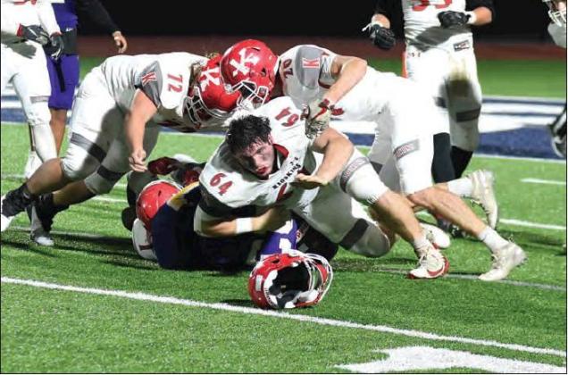 Dibbon Marris • For the Madill Record Kingston senior lineman Caleb Yeager (644) finishes a play during the Redskins’ 35-7 loss to Vian Dec. 6 during the Class 2A Playoff Semifinals.