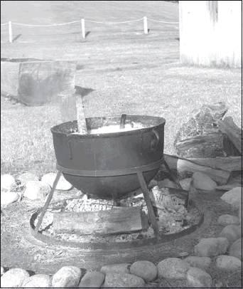 Courtesy Photo A traditional Chickasaw corn-based dish called pashofa is prepared for community members visiting the Chikasha Inchokka’ Traditional Village at the Chickasaw Cultural Center. The Oct. 3 Cultural Evening event will be the perfect chance to try pashofa.