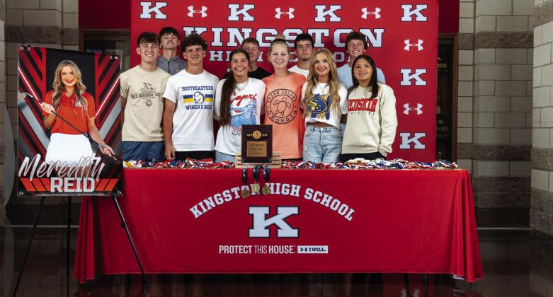 Meredith Reid, second from right in the front row, poses with friends after signing her college letter of intent to play golf for SE. She was the 2023 Golf State Champ, the LLC Champion for three years, an individual placer in all of her high school years and Chickasaw Pointe course record holder. Photo courtesy of Kingston Public Schools