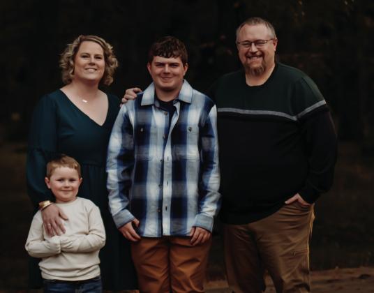 Elissa Cox, pictured with her family, has been the ECC Principal for 12 years. Courtesy photo