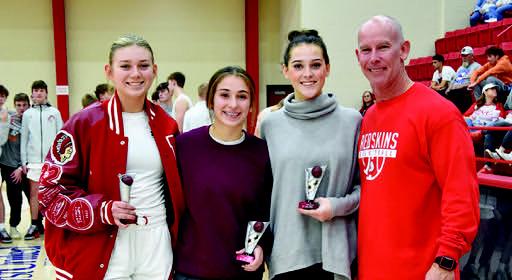 The All-Tournament teams of the 2023 New Years Classic were named. Coach Rumer poses with the three chosen from Kingston. Senior guard Olivia Quapaw who averaged 12 points per game, senior forward Kamry Bohannon who averaged 10.6 points per game, and junior Forward Emily Bellettini who averaged 6.6 points per game. Crockett Uber