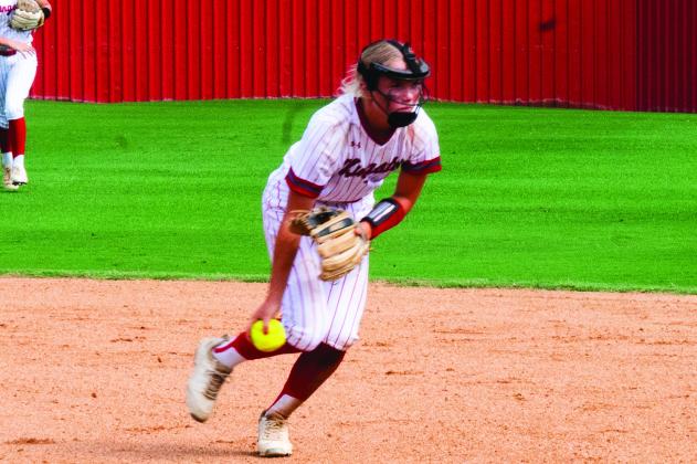 KHS freshman Kate Ratzlaff tries to get a runner out. Courtesy photos