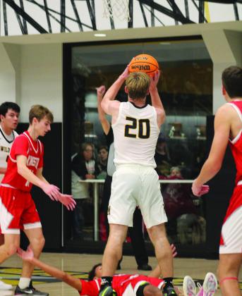 Madill’s Ryan Anderson shoots during the Madill v. Kingston game. Summer Bryant