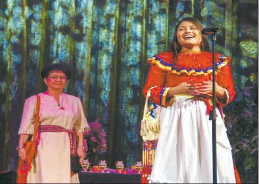 Courtesy Photo Mikayla Hook’s maternal grandmother, Ruth Shelley, accompanies her during the onstage tribal greeting portion of the Miss Indian Oklahoma Scholarship Pageant Nov. 1 at the McSwain Theatre in Ada. Hook shared the background and inspiration of her Chickasaw regalia.