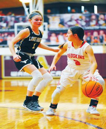 Crockett Uber •For The Madill Record Kingston girls basketball player Lanie French dribbles the ball against a Lone Grove player in a game Jan. 23