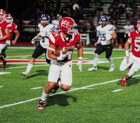 Sophomore Parks Ratzlaff runs the ball down the field during the Kingston vs Coalgate game. The Redskins had a 55-6 victory for their Homecoming game. Mindi Weeks