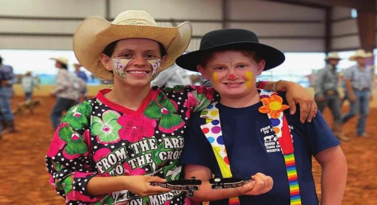 Denver Elrod (right) wins the Walk the Talk award at the Rodeo Bible Camp. His instructor, Madison Ware (left) presented him with the award. Courtesy photo