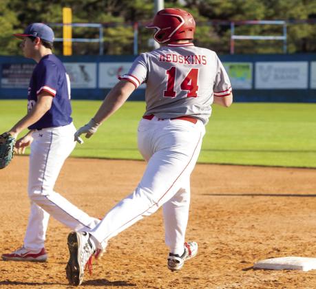 Blane Henry races to first base. Photo by Matt Swearengin