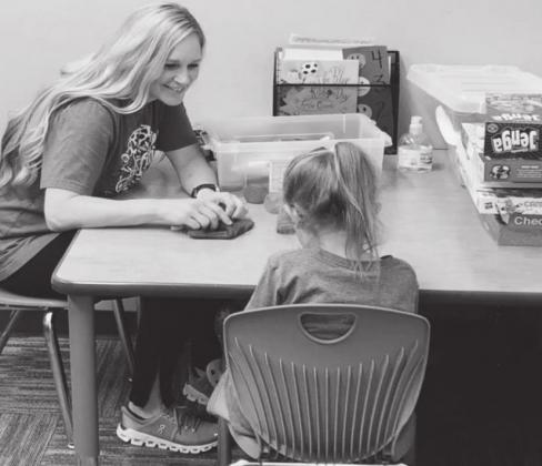 Kim Hamm, an Elk City Elementary School counselor, talks to a pre-kindergarten student. Courtesy photo