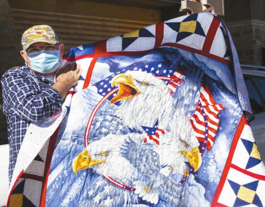 Chickasaw elder and veteran Jerry Pershica displays a quilt he received at the Chickasaw Nation Oklahoma City Senior Center Nov. 10. Courtesy photo