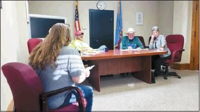Matt Caban • The Madill Record Marshall County Commissioners Josh Cantrell (center), and Don “Salty” Melton share a laugh during their Oct. 21 meeting.