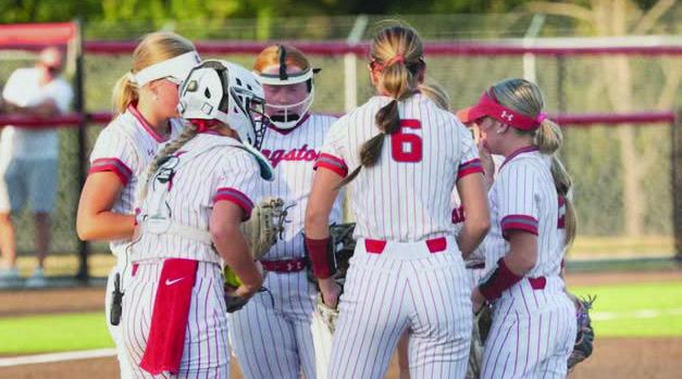 The Lady Redskins softball team huddle up before a play. Courtesy photo