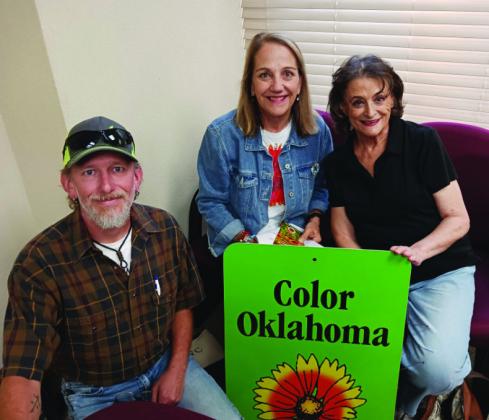 Jayson Pruitt, President of the Madill Rose Garden Club (MRGC), Monica Bartling, President of COLOR OKLAHOMA, and Judy Parkey, Secretary of MRGC pose with the Color Oklahoma sign. Courtesy photo