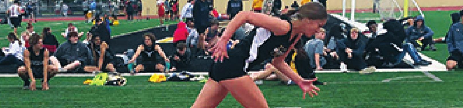 Madill Senior Molly Fulgham takes off during a Madill Track Meet. T.J. Harkins
