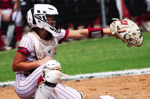 KHS freshman Kate Ratzlaff catches a throw to home plate. Courtesy photos