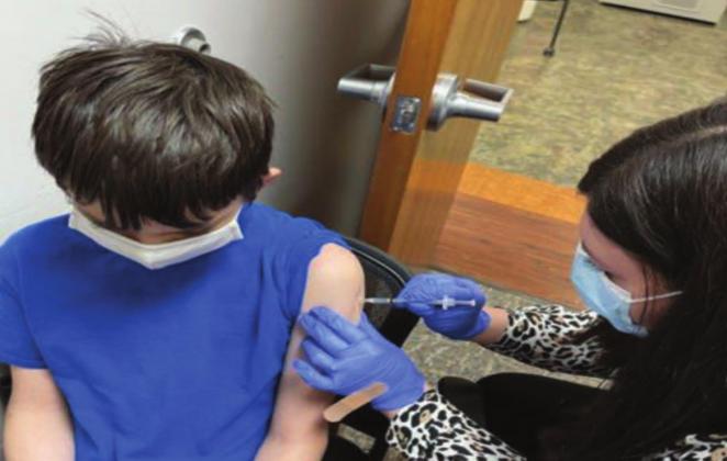 A kid getting his COVID-19 vaccination in the Talihina Clinic. Courtesy photo