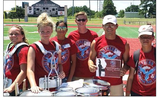 Left: (L to R) Maryn Mancini (tenors), Bethany Stowers (tenor), Jimena Guevara (Drum Major),