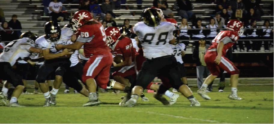 Tony McSwain • The Madill Record The Kingston Redskin offense gets to work on a play against Marietta in their matchup during the 2018 season. The squad values their abilitiy to both run and throw ball .