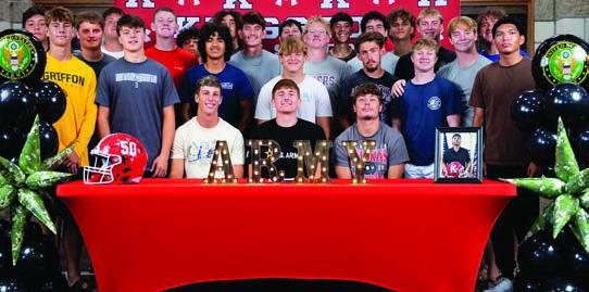 Pictured left: Marshall County Chamber of Commerce held a ribbon cutting ceremony for the Little Bear Dance Center. Pictured above: Lucas Taylor, surrounded by friends, enlisted in the Army. Courtesy photos