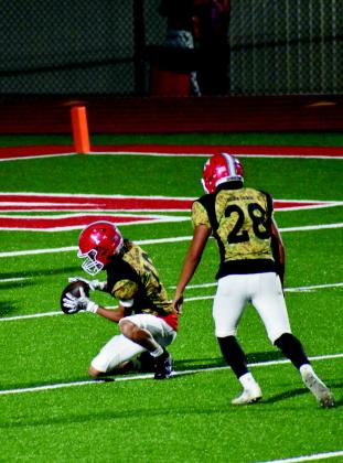 Eli Oliger, pictured left, catches a ball and Jaime Lewis, pictured right, sets up to kick the ball. Courtesy photos