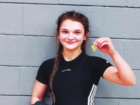 Madill's Brayleigh Thompson is the fi rst in school history from the Lady 'Cats wrestling team to place at a regional tournament and earn a spot in the state tournament later this month in Oklahoma City. Courtesy photo