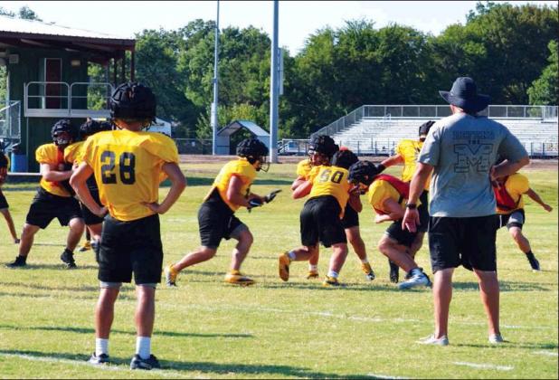 Matt Caban • The Madill Record THE Madill High School football team goes through practice on August 19 at their practice field. The team is set to debut in a scrimmage at Durant High School on Friday, August 23. The Madill freshmen will start things off at 6 p.m. with the varsity squad facing their hosts afterwards.