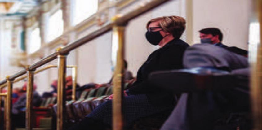 House Minority Leader Emily Virgin, D-Norman, watches from the gallery as Gov. Kevin Stitt gives his third State of the State address at the Capitol on Feb. 1, 2021. Whitney Bryen • Oklahoma Watch