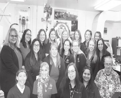 ECU Early Childhood Education majors Katelynn McCarn (back row, fourth from left) and Anna Turlington (back row, second from right) were among a group of present and future educators to attend the NASA Oklahoma Space Grant Consortium’s “Mission to Planet Earth” event in Houston. Courtesy photo