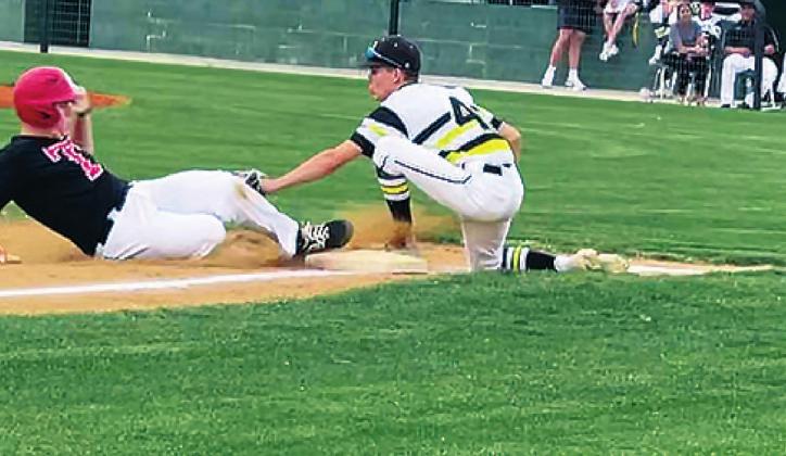 Case Coble tags a runner out on third base. Toby Coble