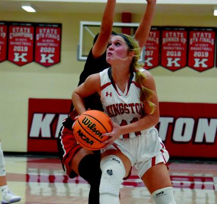 The Kingston Middle School basketball teams both defeated Tishomingo in the Kingston Tournament on November 6. Luke Bellettini, left, goes for a jump shot and Emma Bridgeman right, bodies her way into the paint. Courtesy photos
