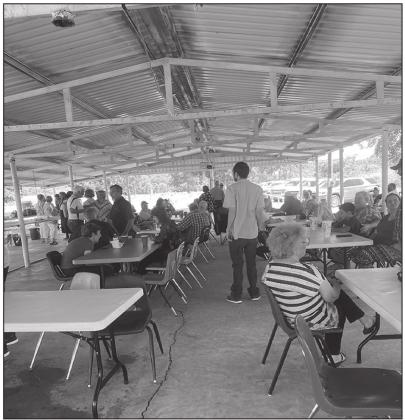 Residents from Marshall County waiting for the potluck lunch to start. Gary Jackson