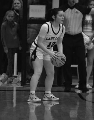 Haylee Elkins prepares to shoot. Summer Bryant ·The Madill Record