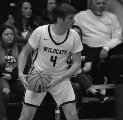 Kendall Robertson gears up to dribble down court. Summer Bryant ·The Madill Record