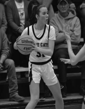 Jayden Weiberg looks for an open player to pass the ball to during a game. • Summer Bryant · The Madill Record