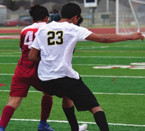 Mason Coles fights off the opponent during the Madill v. Atoka game on March 2, 2021. Summer Bryant • The Madill Record